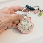 Leather paw keychain with storage compartment