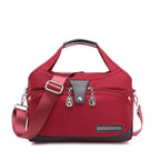 Women's handbag with shoulder strap and multiple compartments