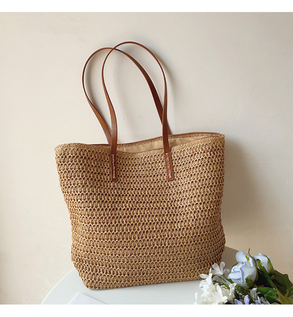 Woven basket bag with leather handles