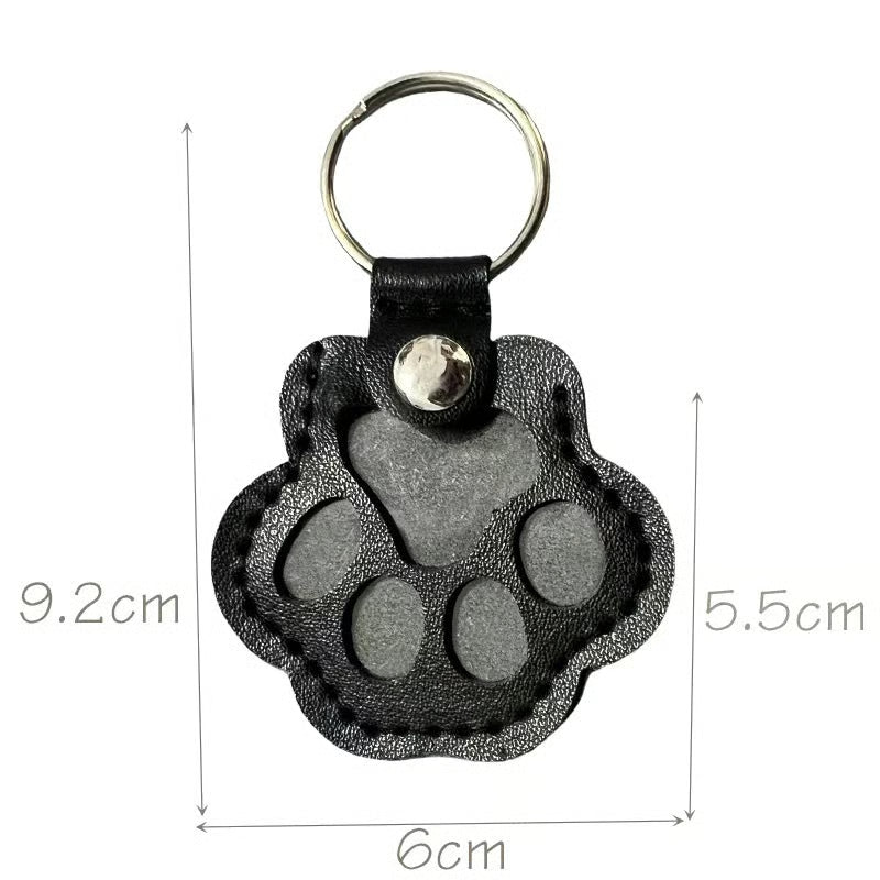 Leather paw keychain with storage compartment