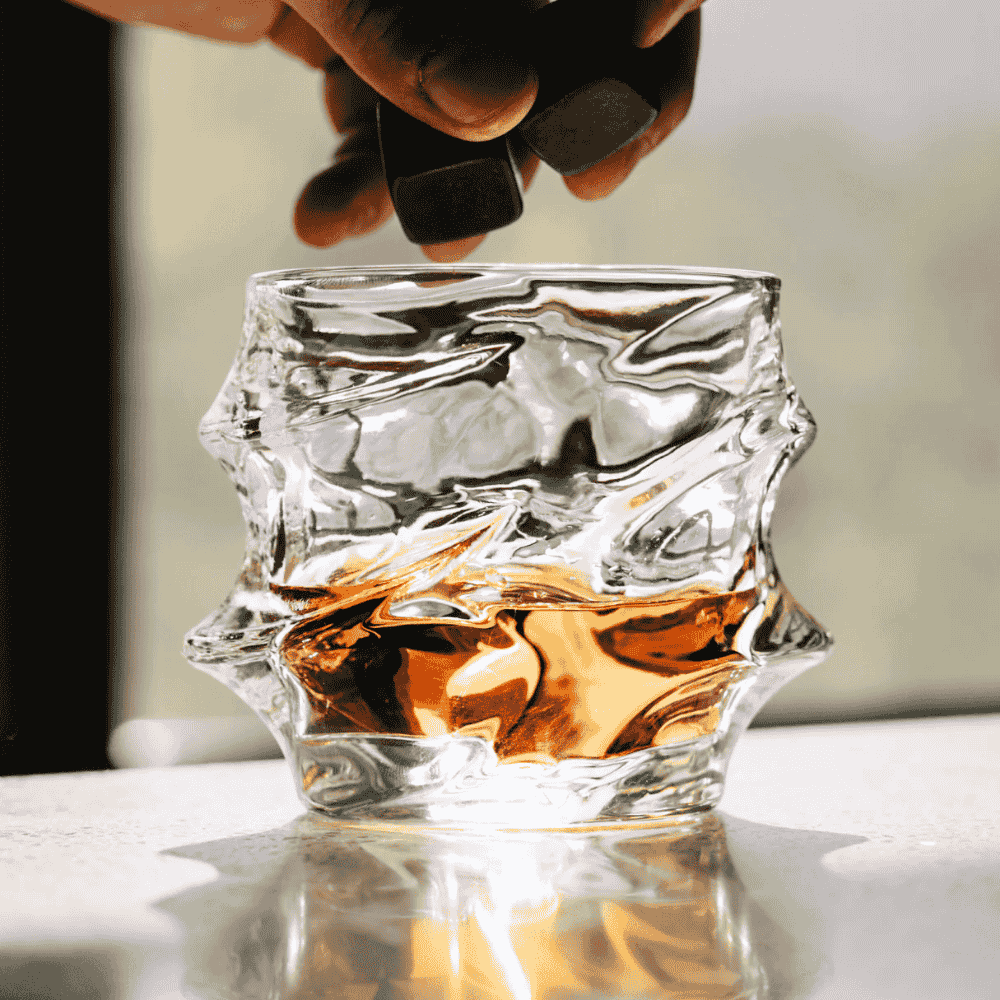 Crystal whisky glass with faceted design
