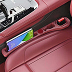 Car seat gap filler with storage compartments
