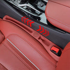 Car seat gap filler with storage compartments