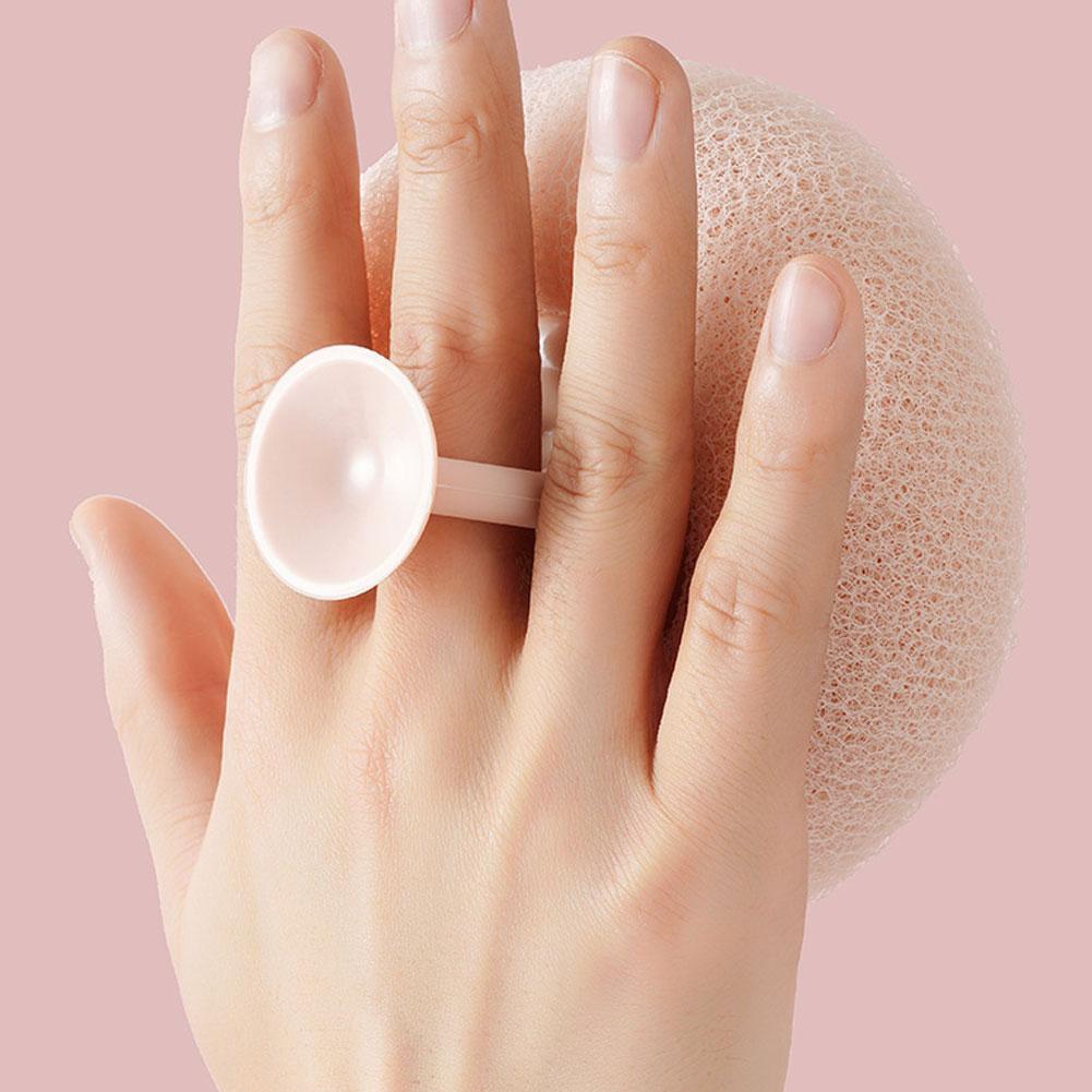 Shower sponge with massage particles and handle