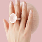Shower sponge with massage knobs and ergonomic handle