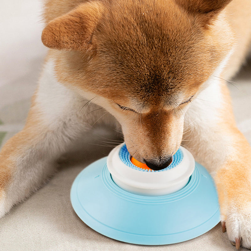 Bowl with floating ball for slow feeding
