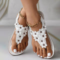 Sandalen mit Blumendetail – Eleganter T-Steg mit dekorativen Blüten