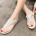 Sandalen mit Blumendetail – Eleganter T-Steg mit dekorativen Blüten