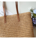 Woven basket bag with leather handles