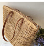 Woven basket bag with leather handles