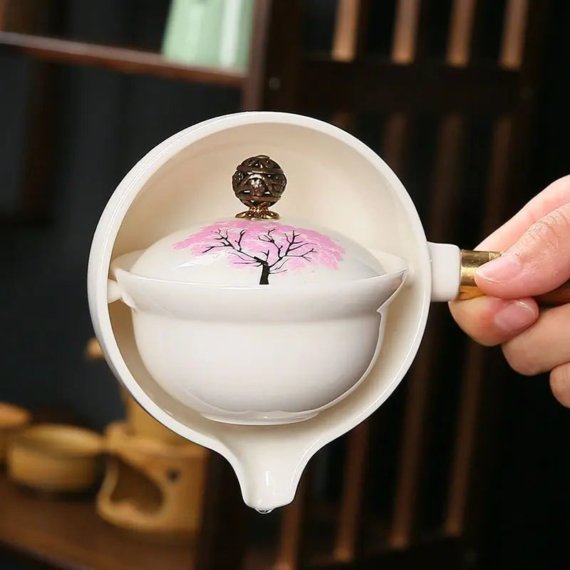 Teekanne ceramic with cherry blossom decor and rotating strainer