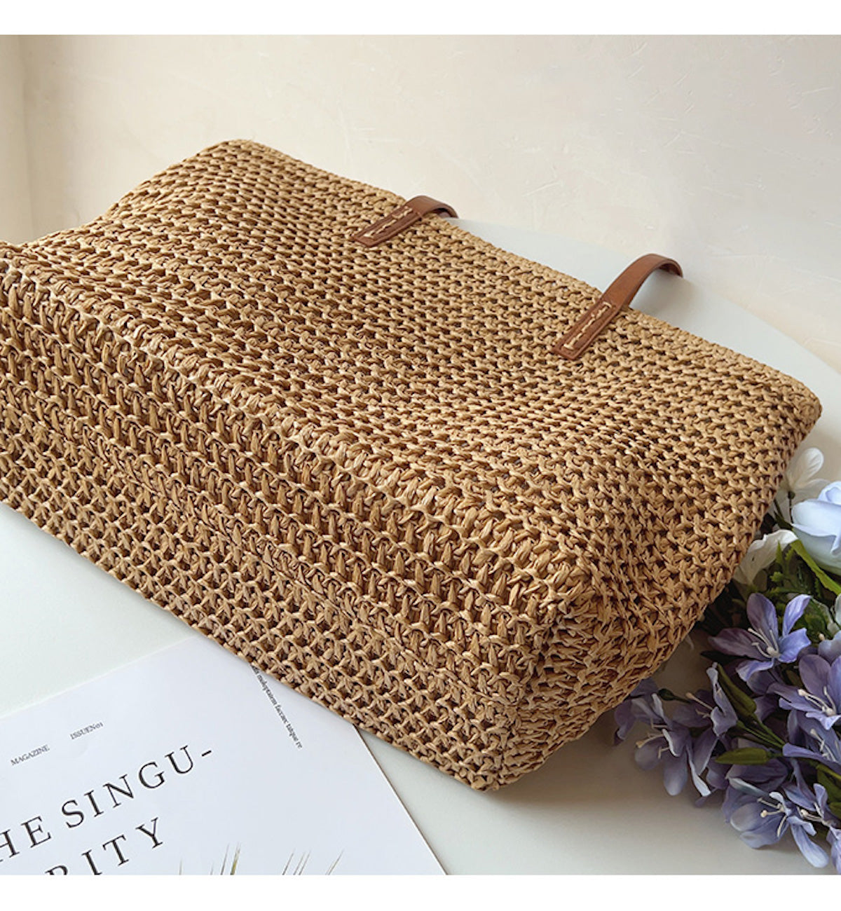 Woven basket bag with leather handles