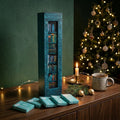 Book advent calendar with 25 mini books on a bookshelf, turquoise