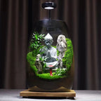 Moos-Terrarium mit Miniaturlandschaft im Glas
