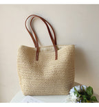 Woven basket bag with leather handles