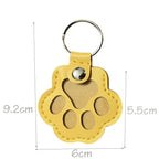 Leather paw keychain with storage compartment