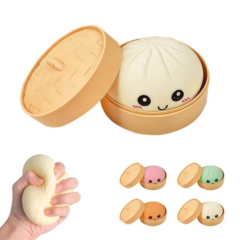 Dumpling-Quetschspielzeug mit Gesicht im Dämpferkörbchen