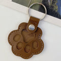 Leather paw keychain with storage compartment