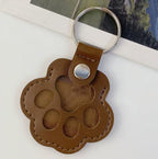 Leather paw keychain with storage compartment