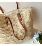 Woven basket bag with leather handles