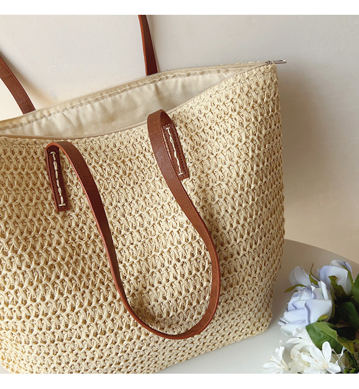 Woven basket bag with leather handles