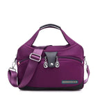 Women's handbag with shoulder strap and multiple compartments