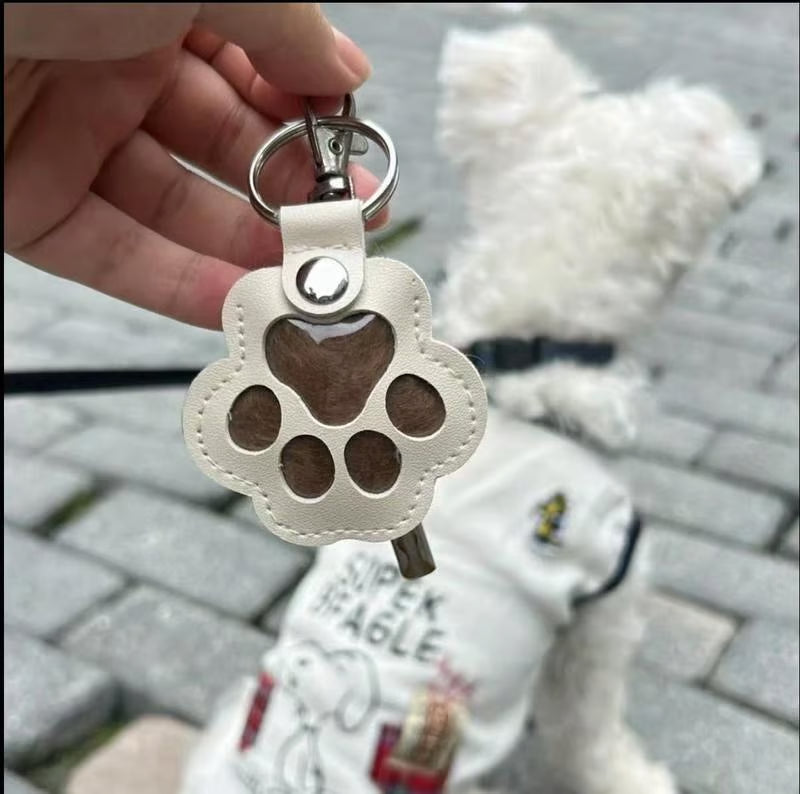 Leather paw keychain with storage compartment