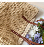 Woven basket bag with leather handles