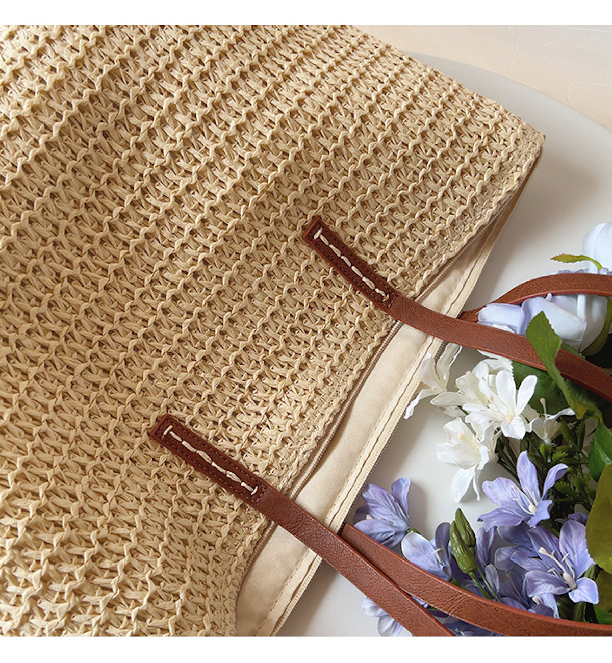 Woven basket bag with leather handles
