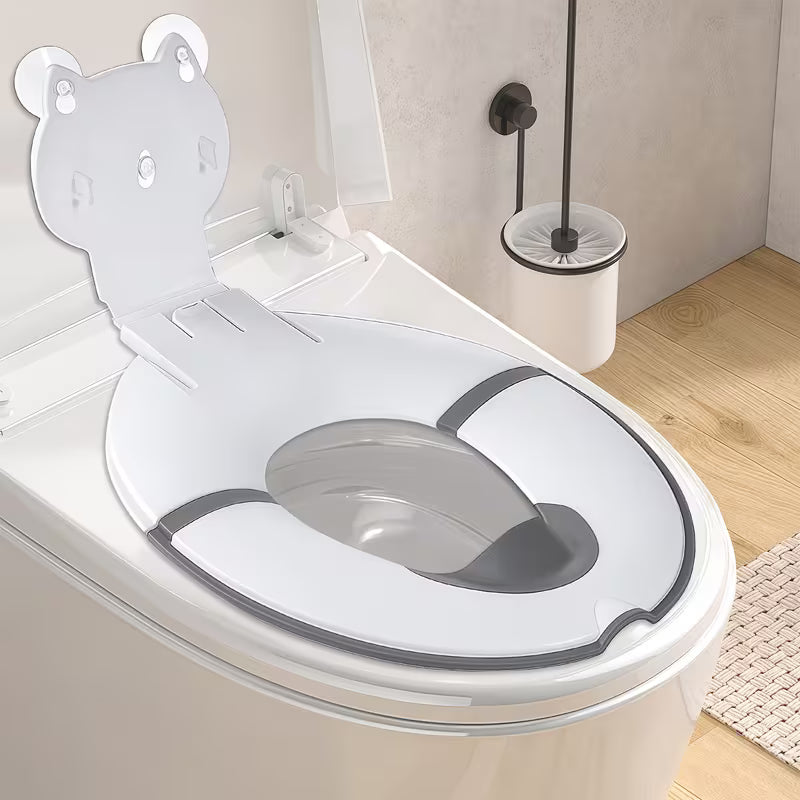 Children's toilet seat with splash guard