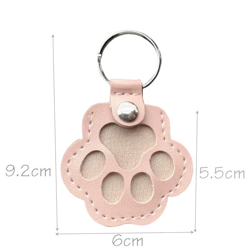 Leather paw keychain with storage compartment
