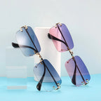 Sonnenbrille randlos rechteckig mit Metallbügeln und getönten Gläsern