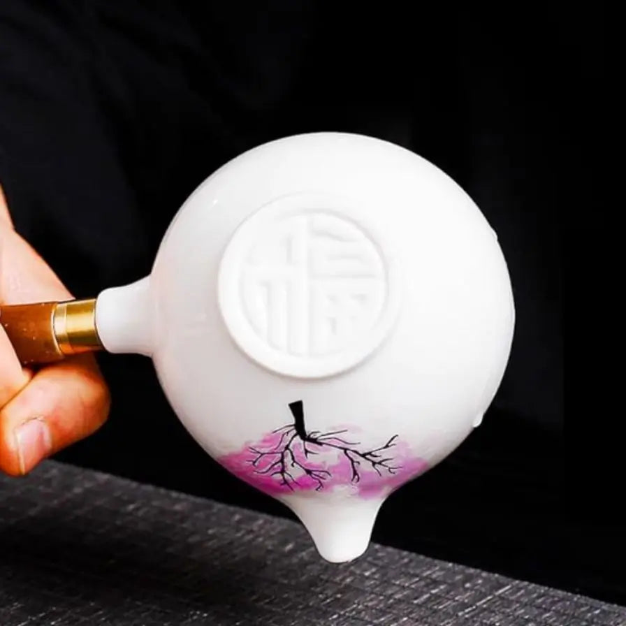 Teekanne ceramic with cherry blossom decor and rotating strainer