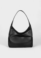 Shoulder bag made of faux leather with external pocket