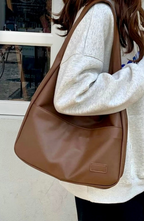 Shoulder bag made of faux leather with external pocket