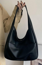 Shoulder bag made of faux leather with external pocket