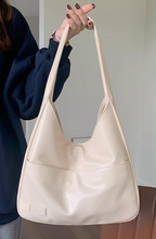 Shoulder bag made of faux leather with external pocket