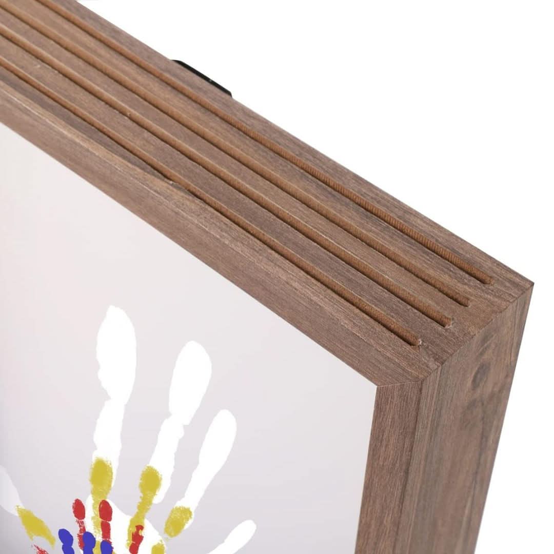 Baby memory frame with clay for hand and footprint impressions
