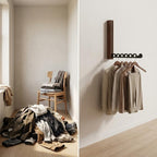 Foldable wall-mounted wooden coat rack with a space-saving design