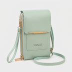 Crossbody phone bag with touchscreen window and card slots, faux leather