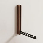 Foldable wall-mounted wooden coat rack with a space-saving design