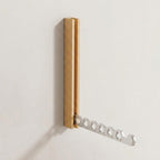Foldable wall-mounted wooden coat rack with a space-saving design