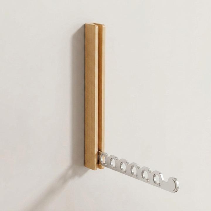 Foldable wall-mounted wooden coat rack with a space-saving design