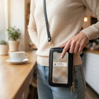Crossbody phone bag with touchscreen window and card slots, faux leather