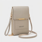 Crossbody phone bag with touchscreen window and card slots, faux leather
