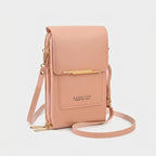 Crossbody phone bag with touchscreen window and card slots, faux leather