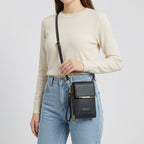Crossbody phone bag with touchscreen window and card slots, faux leather