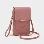 Crossbody phone bag with touchscreen window and card slots, faux leather