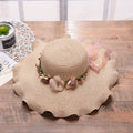 Summer hat with floral decoration for women