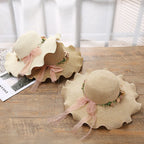 Summer hat with floral decoration for women